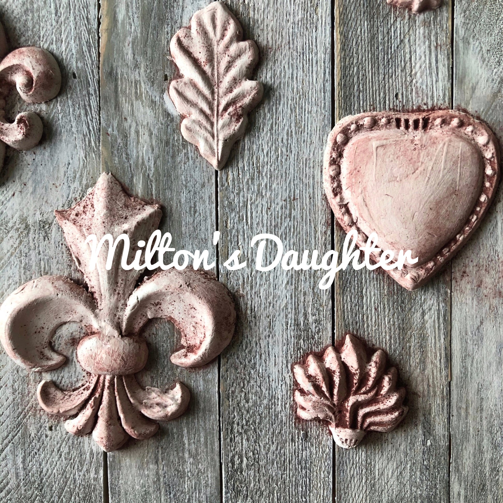 IOD Fleur De Lis Mold castings mounted on wood at Milton's Daughter