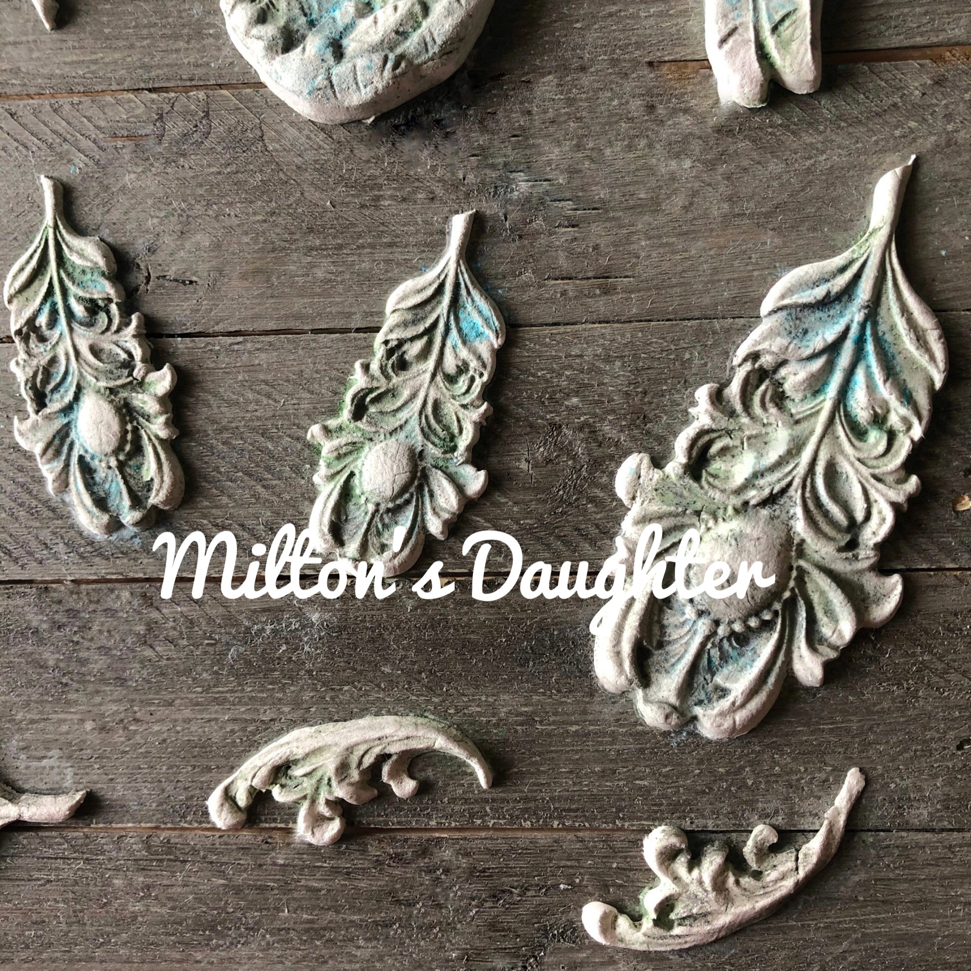 Wings and Feathers mold by IOD painted castings mounted by Milton's Daugher